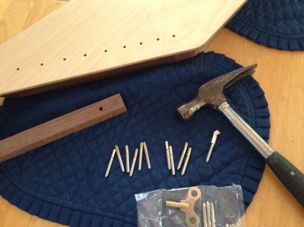 Image of tools and materials ready to install zither pins.